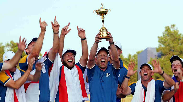 Team Europe captain Luke Donald and Team Europe celebrates with the Ryder Cup after beating Team USA during the final day of the 2023 Ryder Cup at Marco Simone Golf and Country Club.